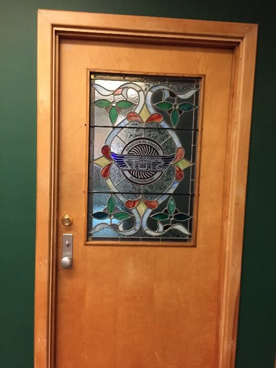 A door with stained glass in the center.