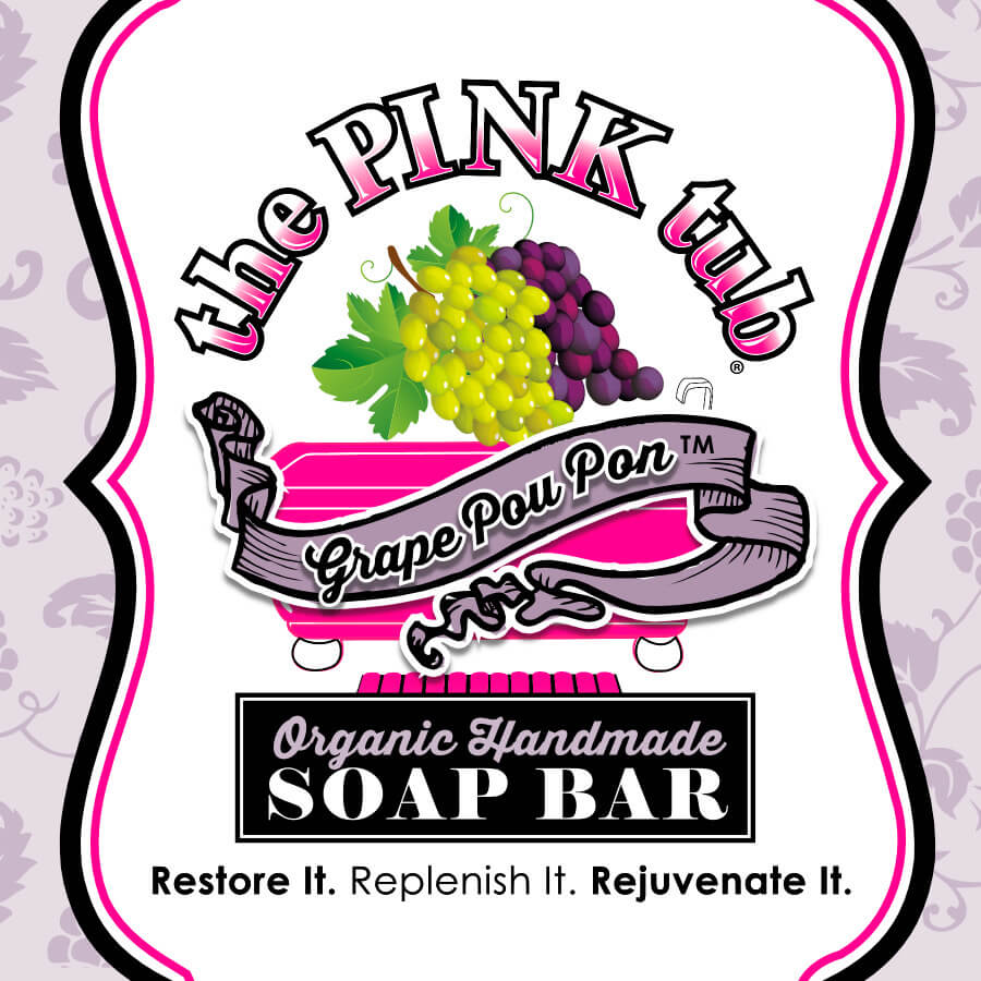 A pink tub soap bar with grapes and ribbon.