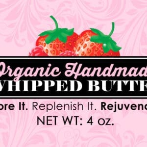 A pink background with strawberries and the words organic handmade whipped butter.