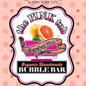 A pink label with an orange and grapefruit