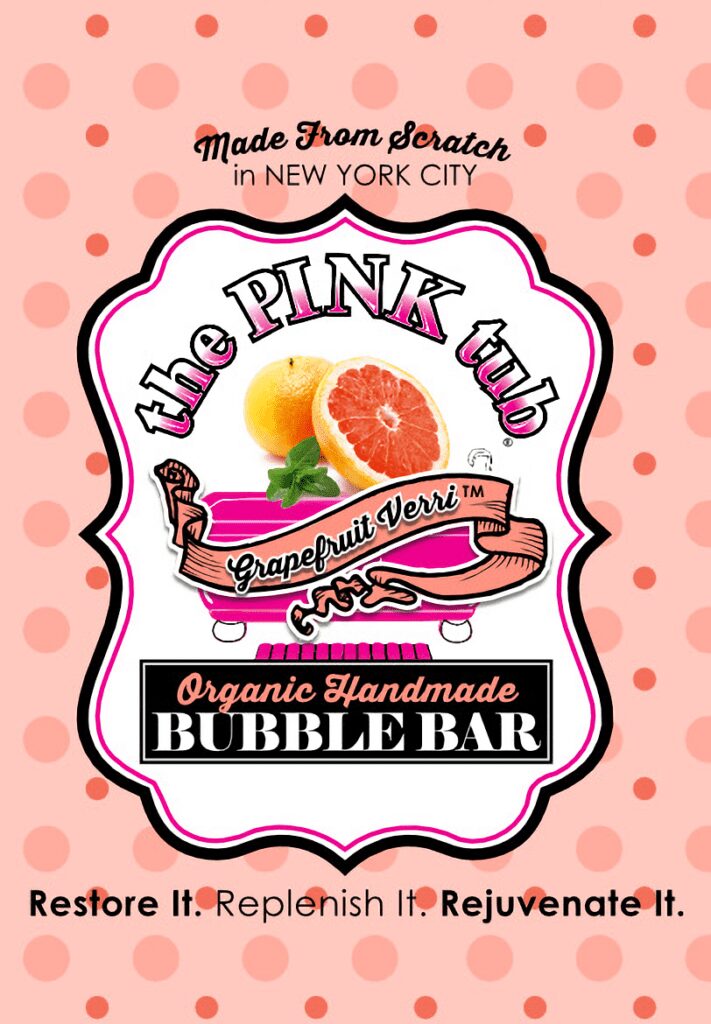 A pink label with an orange and grapefruit