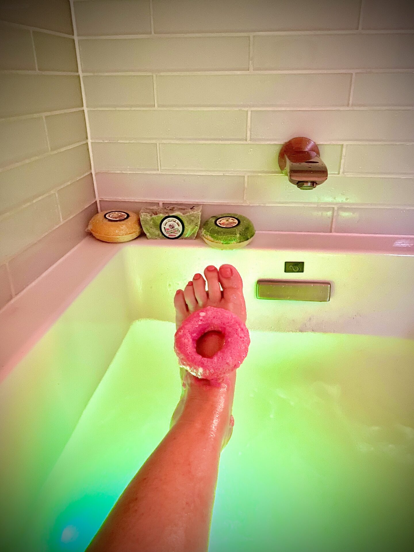 A person with their foot in the tub